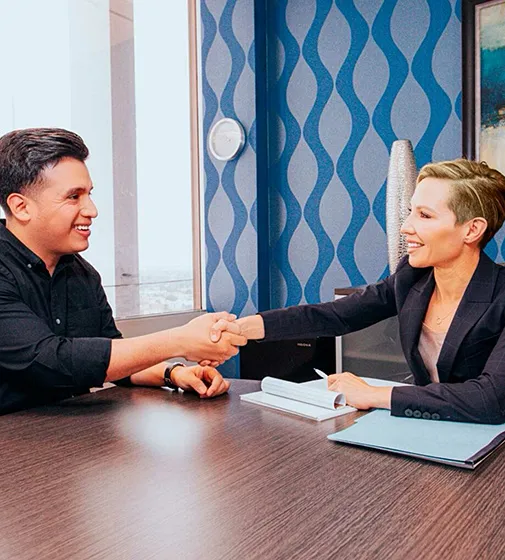 Deborah Gutierrez, Oxnard employment lawyer, shaking hands with client